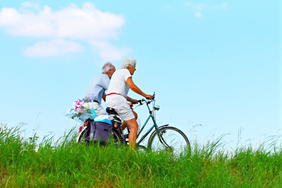 Elderly couple biking